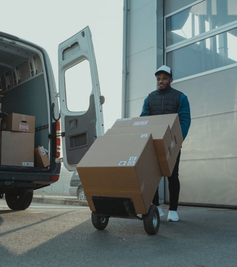 Man moving boxes on trolley